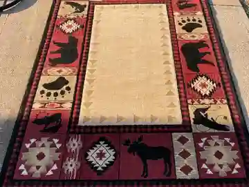qt=q_11 (6) A rug with animals and bear designs on it.